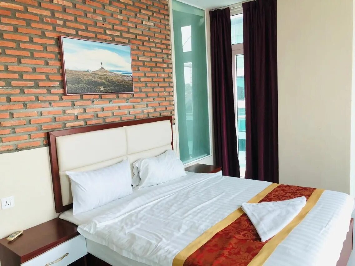 Deluxe Balcony at Sai&Su Hotel Phnom Penh - Private outdoor sanctuary with city air